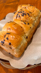 Fresh baked homemade sweet stuffed bread with chocolate and cheese for breakfast, Baked bun made of yeast dough in a rustic style on white background