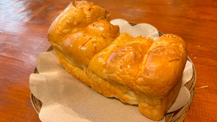 Fresh baked homemade sweet stuffed bread with chocolate and cheese for breakfast, Baked bun made of yeast dough in a rustic style on white background