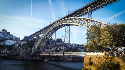 Porto, Portugal old town skyline on the Douro River with rabelo boats.