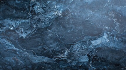 Obraz premium A close-up view of blue and black marbling with light streaks from above