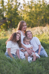 Fototapeta premium A beautiful Family Portrait captured amidst the serene beauty of Nature and greenery