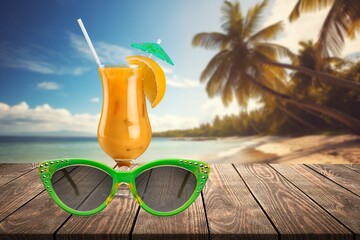 Tasty cold exotic cocktail on sand beach