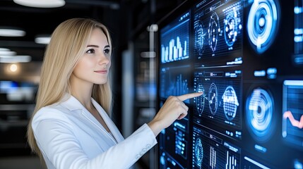 A focused business professional examines analytics on a digital interface, demonstrating expertise in data interpretation during a late evening in a contemporary workplace