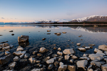 Serene view of snowy mountain at Lake Tekapo, New Zealand.