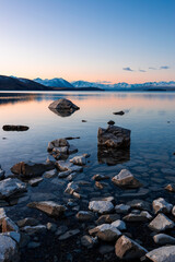 A tranquil sunset view at Lake Tekapo, New Zealand.