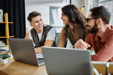 Professionals engage in a supportive conversation in office.