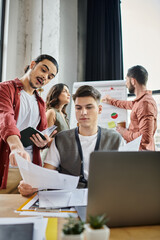 Professionals in stylish attire converse actively in office.