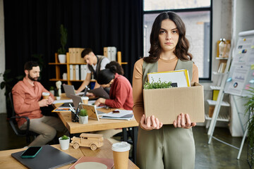 Woman express mixed emotions while navigating a challenging layoff situation, colleagues on...
