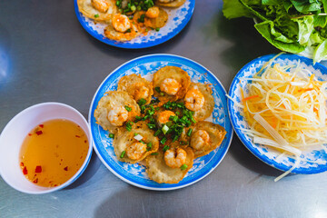 Vietnamese tiny shrimp pancake- Banh Khot Vung Tau. Vietnamese local cuisine. Served with...