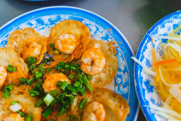 Vietnamese tiny shrimp pancake- Banh Khot Vung Tau. Vietnamese local cuisine. Served with...