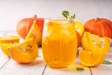 Pumpkin and orange autumn lemonade drink. Sweet tasty drink for fall Thanksgiving party, tasty fruit punch or margarita cocktail