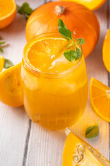 Pumpkin and orange autumn lemonade drink. Sweet tasty drink for fall Thanksgiving party, tasty fruit punch or margarita cocktail