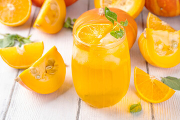 Pumpkin and orange autumn lemonade drink. Sweet tasty drink for fall Thanksgiving party, tasty fruit punch or margarita cocktail
