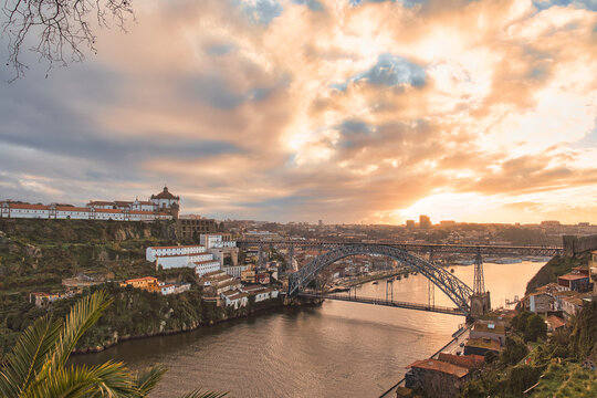 Cloudy sunset view of Dom Luiz bridge, Porto, Portugal