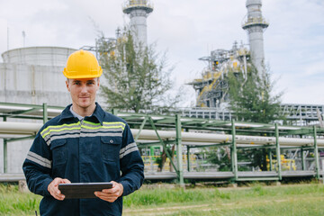 Portrait industrial engineer male with oil and gas refinery, Service worker working in petroleum...