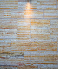 Background Cover or Template of a White , Yellow, and Tan Marble Block Wall.