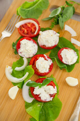 tomato wedges with cottage cheese filling and garlic, spicy appetizer