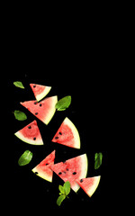 Pieces of ripe watermelon scatter in different directions on a black background. Watermelon slices and mint leaves on a dark background. Fresh red watermelon slices. Composition. Collage