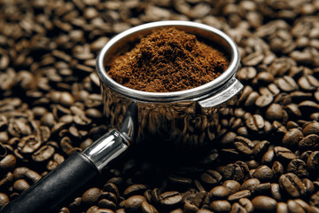 Freshly Ground Coffee Sitting In Portafilter Surrounded By Roasted Coffee Beans