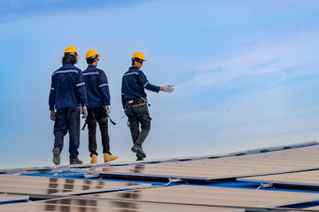 engineer man inspects construction of solar cell panel or photovoltaic cell by electronic device. Industrial Renewable energy of green power. factory worker working on tower roof.