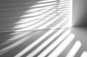 A white wall with blinds shaded. White and black for overlaying a photo or mockup.