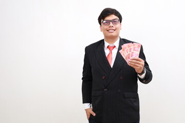 Happy smile Asian man banker standing while holding rupiah banknotes bills isolated on white background