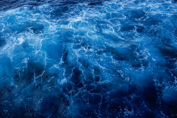 Natural blue waters with white caps. View from a ship. Ocean water.