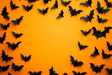 Spooky Halloween Banner with Black Paper Bats Flying on Orange and Yellow Backgrounds - Top View with Copy Space for Event Promotion or Decoration