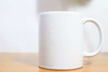 Obraz premium Isolated white cup mug mockup on white background