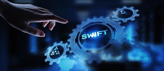 SWIFT international payment system financial technology banking and money transfer concept on virtual screen.