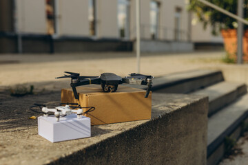 Modern technological delivery innovation - drone fast delivery concept, two multicopters and box
