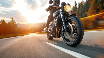 Close-up of a motorcyclist riding a motorcycle on a scenic road at sunset, with motion blur emphasizing speed, surrounded by nature with trees and mountains.