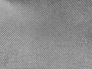 Cloth abstract pattern close macro view, textile abstract background. Black and white monochrome grayscale photo