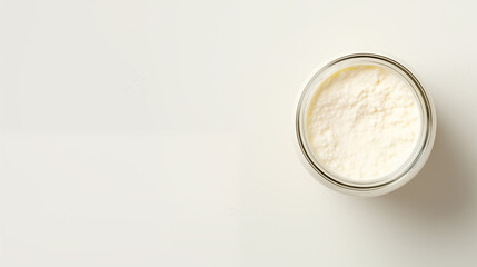 Milk in a tall glass, milk bottle, wedge of cottage cheese, on a uniform ivory background,