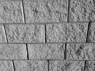 Old brick wall pattern close view background, stone texture surface. Black and white monochrome grayscale photo