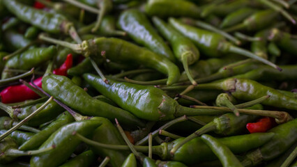 Pile of green chili. Close-up cayenne pepper
