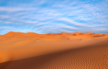 Beautiful sand dunes in the Sahara desert with amazing cloudy sky - Sahara, Morocco