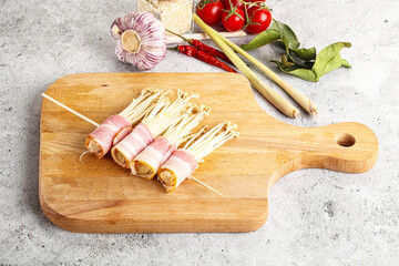 Raw Enoki mushroom with bacon