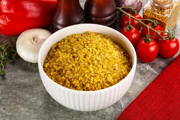 Dry wheat bulgur cereal heap