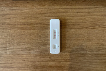 Coronavirus COVID 19 home test kit showing a positive result from an infected adult. Test kits such...