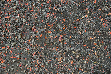 Clay pigeon targets broken over the ground black and orange