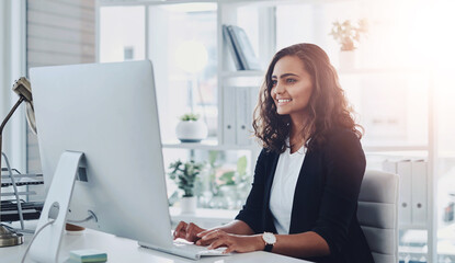 Business woman, working and computer in office with ux designer and social media update with smile. Happy, employee and seo upgrade for company website with creative research for project with tech