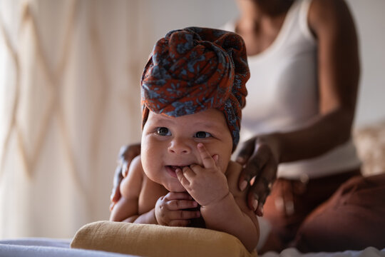 Happy baby enjoying massage
