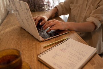 Woman typing on laptop