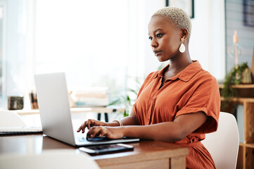 Typing, online and black woman with laptop, serious and thinking of ideas in office and copywriting. Writer, working and creative for website on desk, reading and confident in company and person - Powered by Adobe