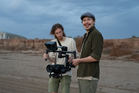 Men filming videos using camera and gimbal