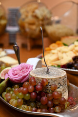 cheese and wine,  table setting, cheeses and fruits, fresh grapes, cheeses, green grapes,  appetizers, snacks, artisanal cheese
