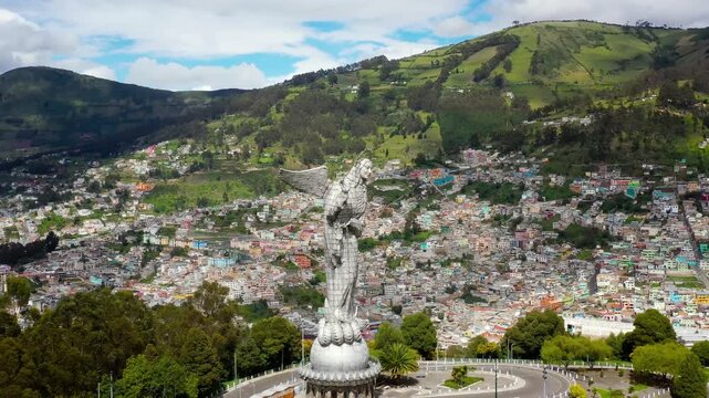 Virgin of the Panecillo Quito cityscape in Ecuador drone footage cloudy day