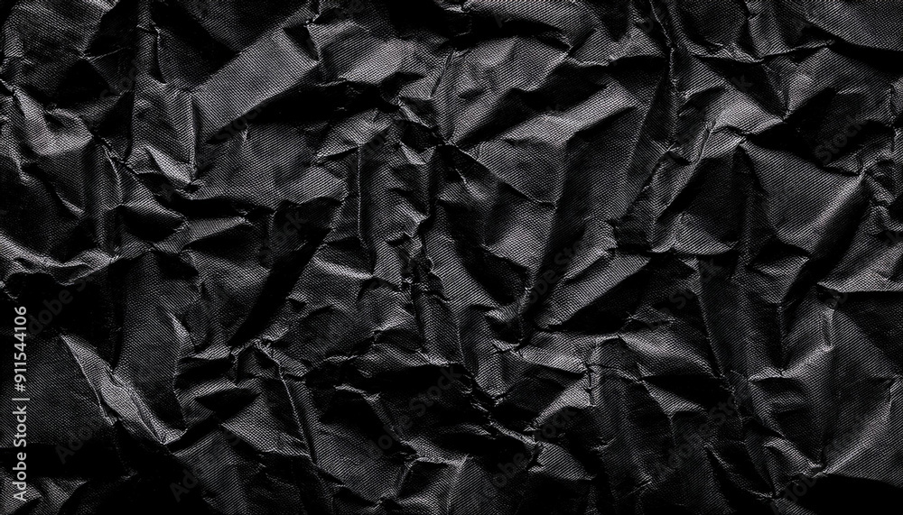 Poster Textured Black Wrinkled Paper. Close-Up of Crumpled Black Fabric Material with Intricate Fold Patterns and Subtle Light Reflections