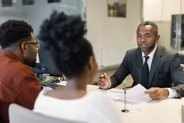 Couple Buying a Car in Office Meeting